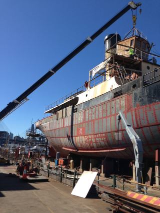 JOHN OXLEY's wheelhouse is craned off the ship for restoration. Hull restoration has been completed to deck level JOWheelhouse